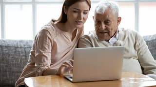 Yound adult woman looking at laptop and talki.width bTSCBAk.jpg
