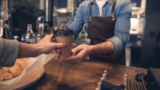 barista handing coffee to customer UySMQTH.width .jpg