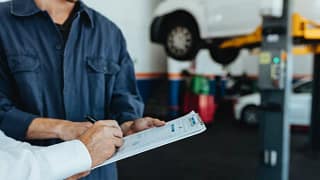 car mechanic signing bill UzgJNlX.width .jpg