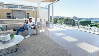 couple on couch in nice house FNNZDZQ.width .jpg