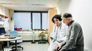 doctor with patient uIxsPm.width .jpg