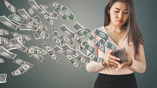 getty lose money fees debt down the drain empty wallet.jpg
