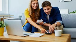 happy couple with calculator wpBfhu.width .jpg