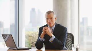 man biz suit desk gettyimages .jpg