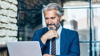 man older business suit laptop gettyimages .jpg