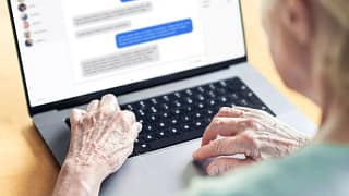 older lady and a chat going on computer screen.jpg