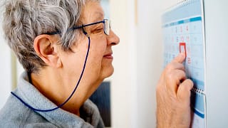 older woman looking at calendar.jpg