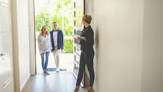 realtor and couple in home.width .jpg