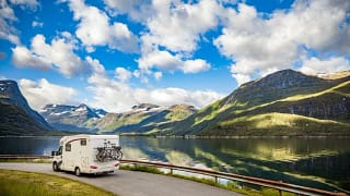 rv driving past mountain lake.width KAplCV.jpg
