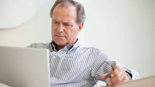 serious senior using laptop social security getty.jpg