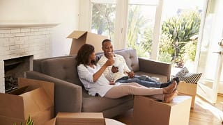 smiling couple toasting with coffee mugs on c.width oXOEFhv.jpg