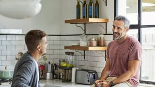 two people talking in kitchen STtBzNx.width .jpg