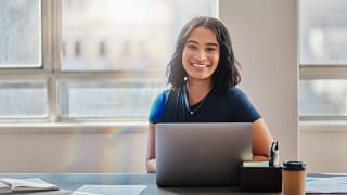 woman s smiling laptop gettyimages .jpg