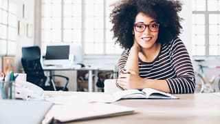 woman s smiling table gettyimages .jpg