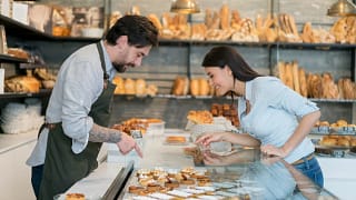 woman buying pastry at bakery.width .jpg
