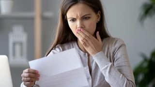 woman surprised at bill.width HBTG.jpg