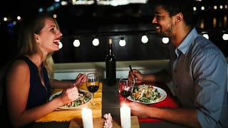 young man and woman sitting at table eating d.width xnzmD.jpg