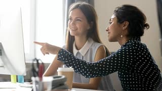 Female mentor pointing at computer oqArKy.width .jpg