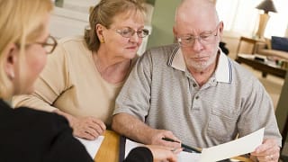 Older couple looking at paperwork DyGr.width .jpg