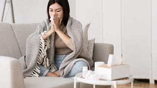 Sick woman blowing nose qBgNC.width .jpg