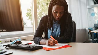 Woman highlighting a document gNOv.width .jpg