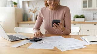 Woman working on her tax documents. fbmsSE.width .jpg