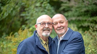 getty couple in blue outside smiling.jpg