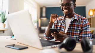 man s laptop smiling gettyimages .jpg
