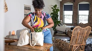woman unpacking grocery bags.width .jpg