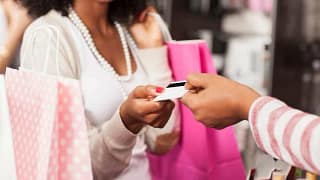 woman with shopping bags credit card ddxVhg.width .jpg