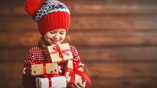 Child holding gifts aDeIo.width .jpg