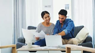 CoupleDoingPaperworkWithLaptop.width eAitaC.jpg