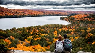 Couple overlooking view of fall foliage fCHc.width .jpg