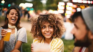 Friends drinking beer at summer concert UeeF.width .jpg
