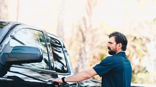 Man getting in to his pickup truck hqYKe.width .jpg