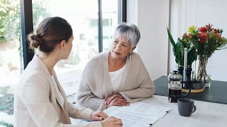 Older woman speaks with young professional Qk.width .jpg
