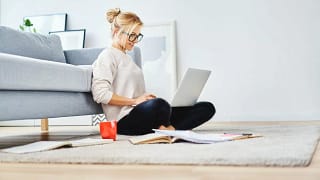 Young woman on laptop on floor foenms.width SXqJT.jpg