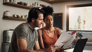 couple looking at paperwork together.jpg