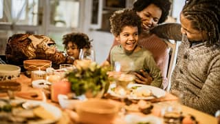 familly at thanksgiving table nifWbj.width .jpg