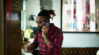 man on phone call and laptop XoCgMIF.width .jpg