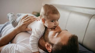 parent and baby on couch UhhpZIa.width .jpg