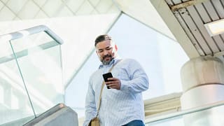 person walking with phone CeNaT.width .jpg