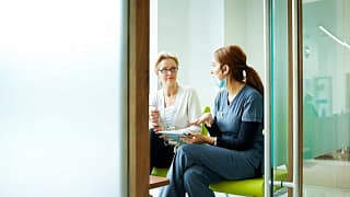 person with medical professional in exam room.width ENskWkF.jpg