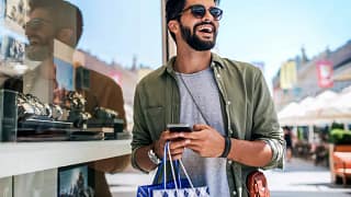 person with shopping bag outisde jewelry stor.width dpprV.jpg