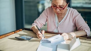 woman reviewing calculating studying.jpg