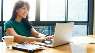 woman on laptop in cafe CDpIRXE.width .jpg