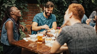 young adults at outdoor restaurant table Xdg.width .jpg