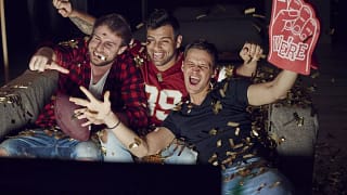 Men watching football on a televisio.width CUQIow.jpg