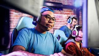Adults engaging in computer gaming in a room .width yOPuzwK.jpg