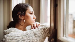 Stressed woman at window hdGj.width .jpg